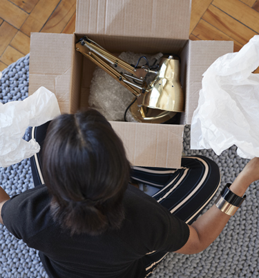 Woman opening up courier package