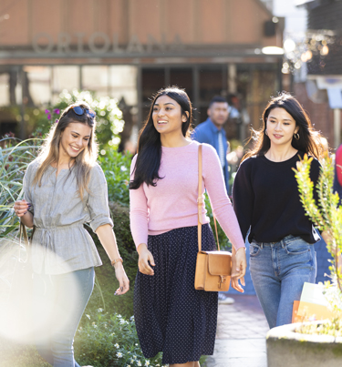 Woman walking in shopping area