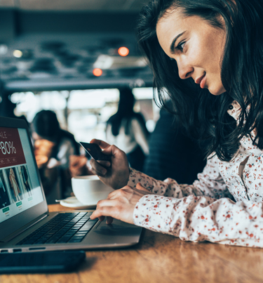 Woman looking at credit card