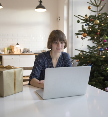 Woman looking at laptop screen