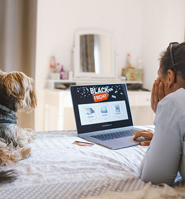 Woman looking at a 'Black Friday sale' on her laptop