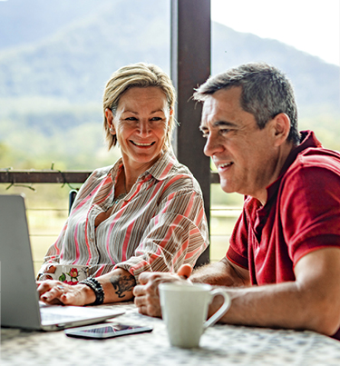 Man and woman infront of laptop