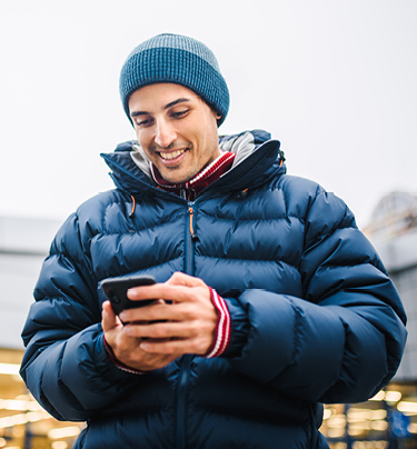 Man looking down at mobile