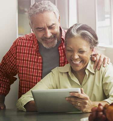 Man and woman looking at tablet