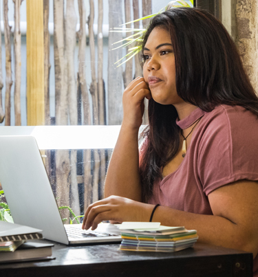 Girl looking at laptop