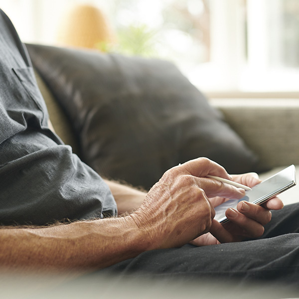 Man writing on touchpad