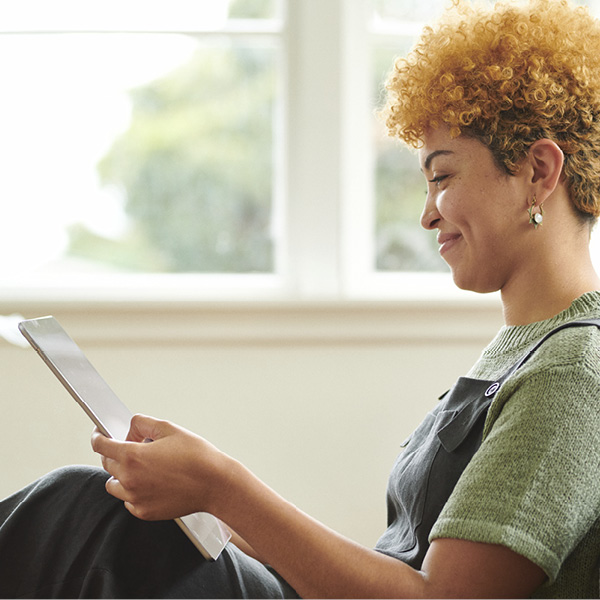 Woman looking at tablet screen