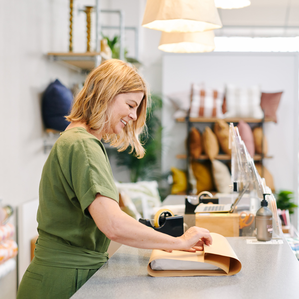 Women wrapping a parcel