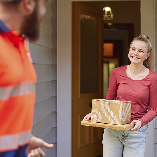 A woman holding courier packages