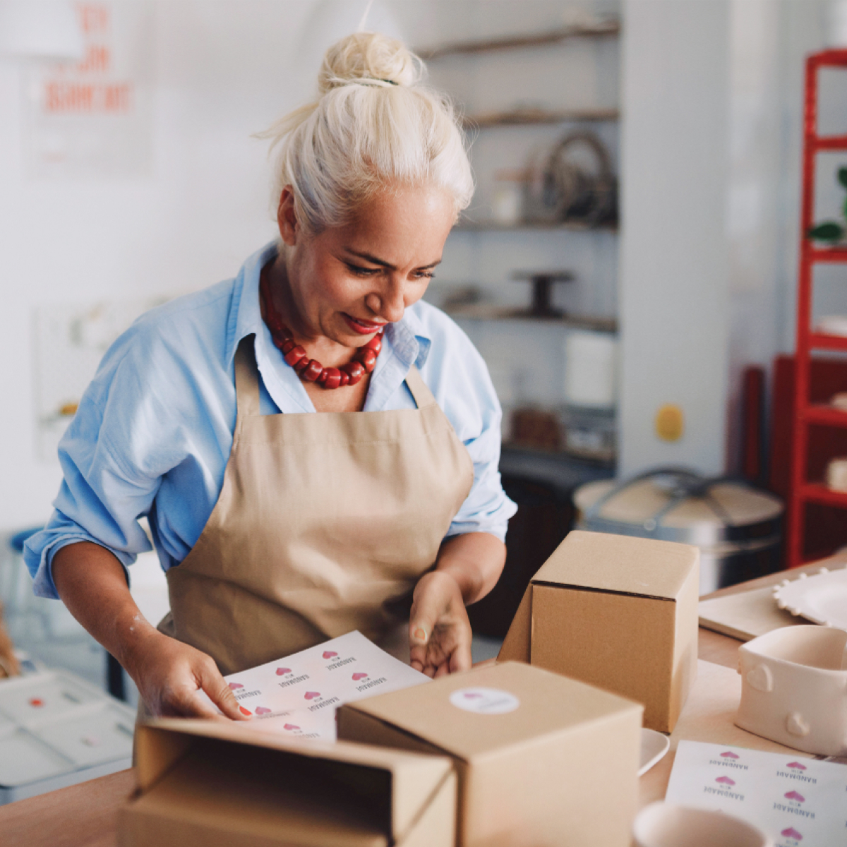 Woman packing in shop mobile