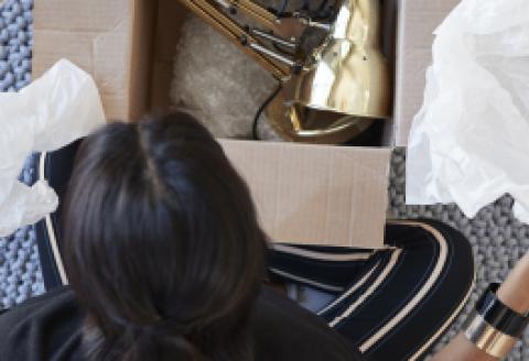 Woman opening up courier package