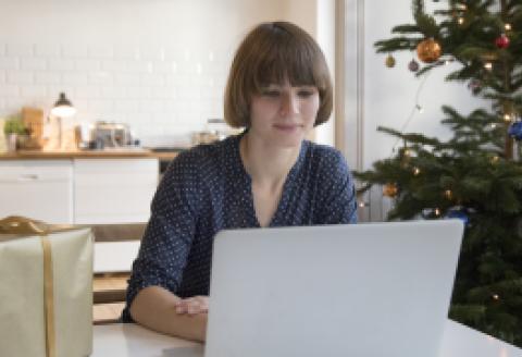 Woman looking at laptop screen