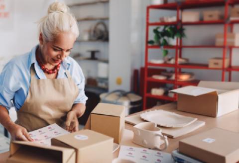 Woman looking down at packaging