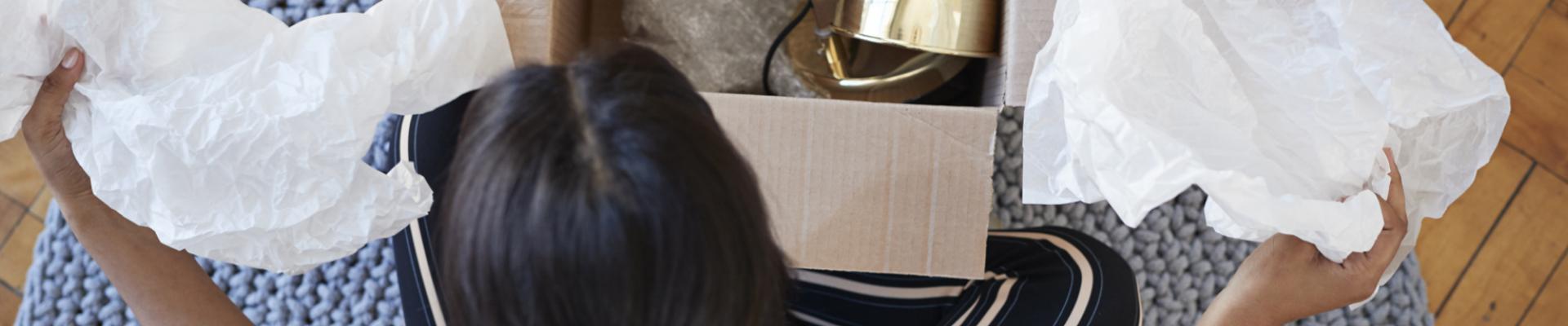 Woman opening up courier package