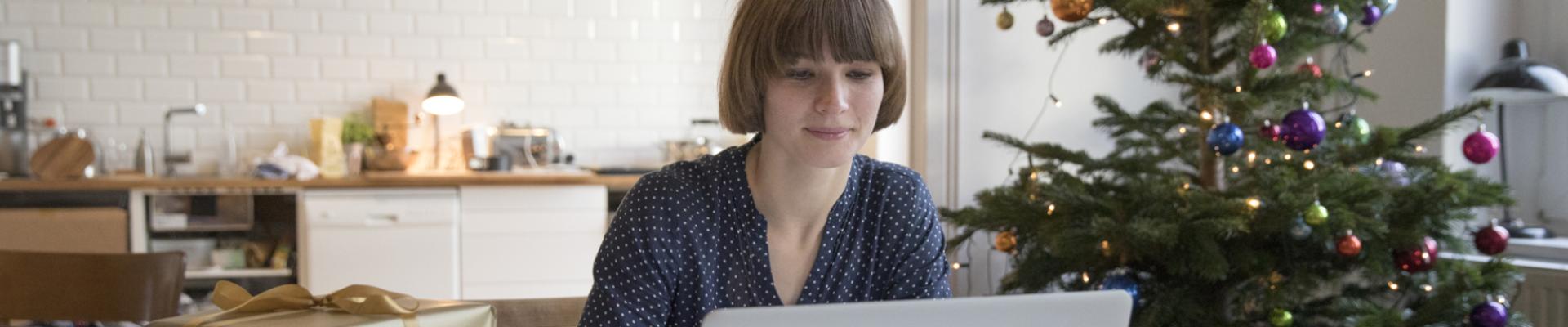 Woman looking at laptop screen