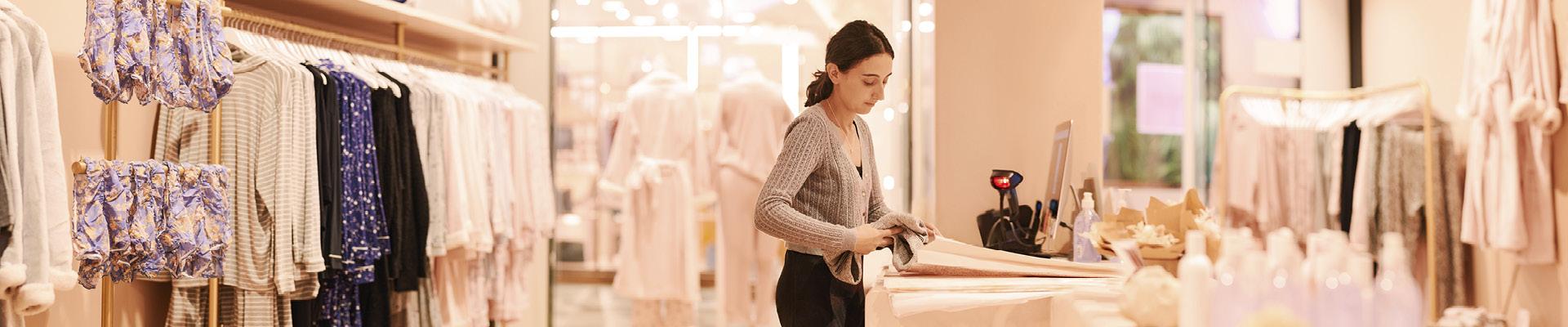 Women in retail store at counter