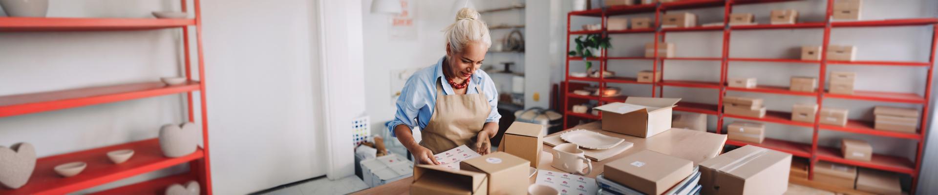 Woman packing in shop