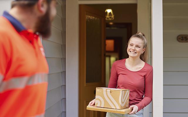 A woman holding courier packages