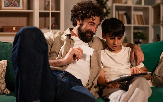 father and son shopping online
